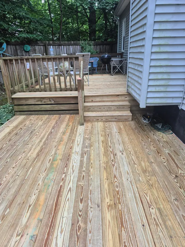 New deck boards and rebuilt steps in natural pine